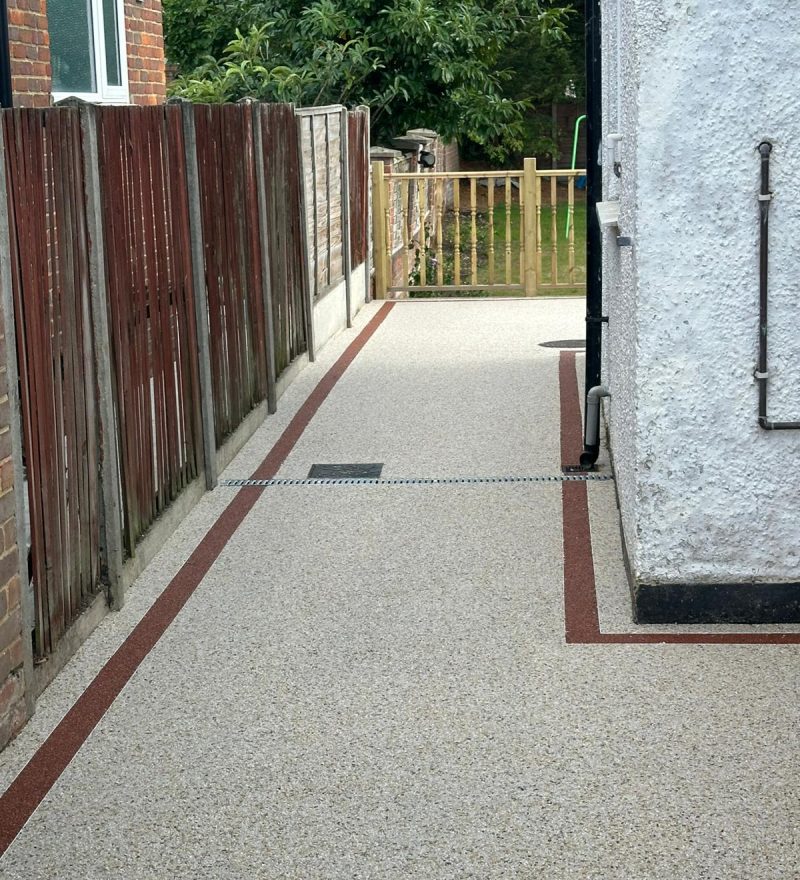 Concrete pathway alongside wall | Unics Construction